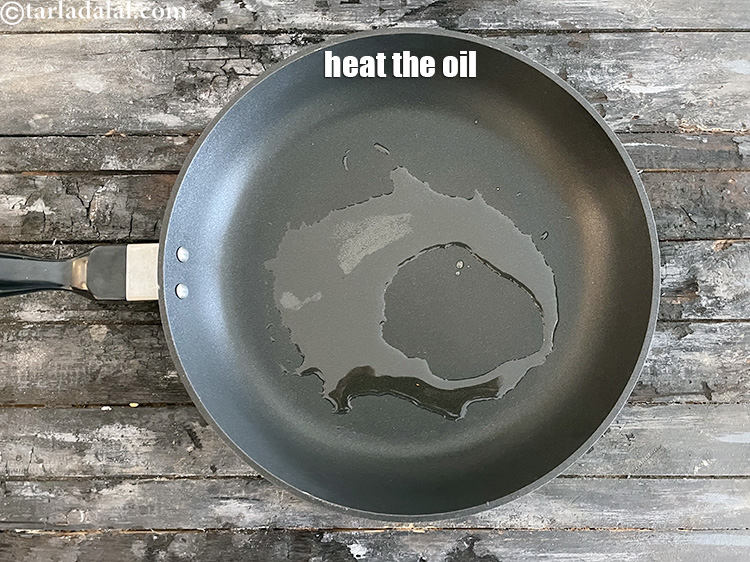 Step 25 – Heat 1 tsp oil in a broad non-stick pan.