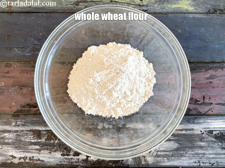 Step 7 – In a deep glass bowl put&nbsp;<meta charset="UTF-8" />1 cup&nbsp;<a href="glossary-whole-wheat-flour-gehun-ka-atta-gehun-ka-aata-429i">whole wheat flour (gehun ka atta)</a>.
