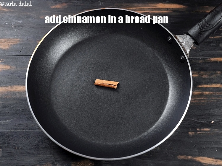 Step 3 – To make <strong>tandoori masala</strong>, in a broad nonstick pan, add 2 small sticks cinnamon.