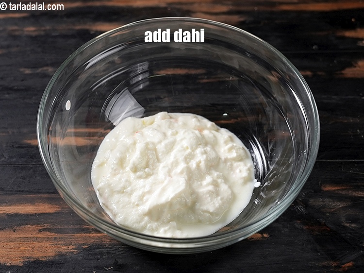 Step 10 – In a bowl, add 1 cup dahi.&nbsp;