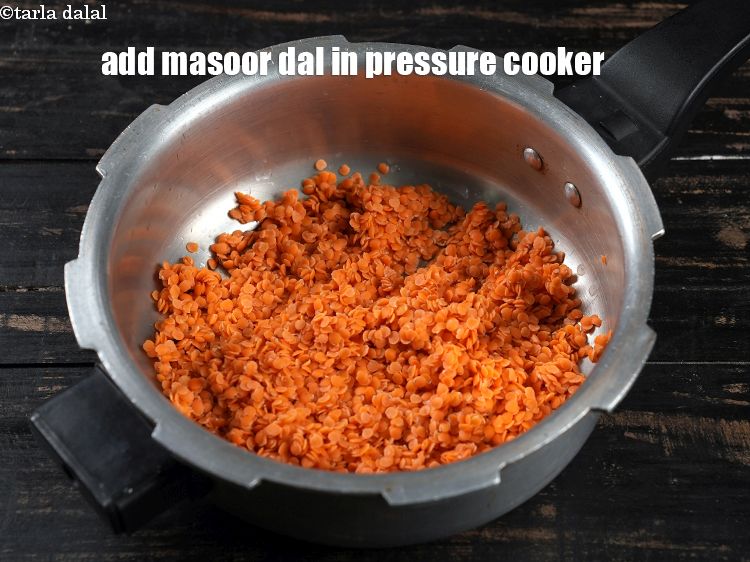 Step 3 – To make <strong>Bengali masoor da</strong>l, in a pressure cooker, add washed and drained 1 cup …