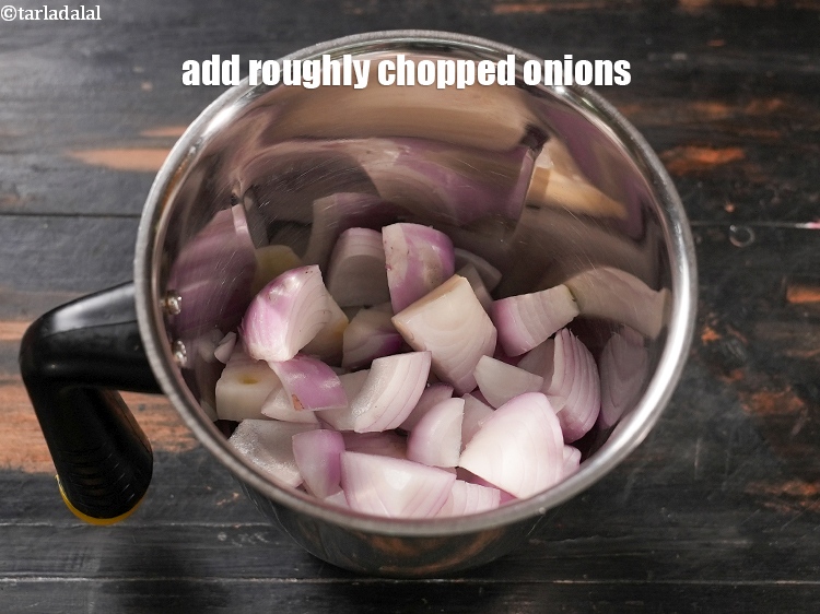 Step 3 – In a mixer jar, add 1 cup roughly <a href="https://www.tarladalal.com/glossary-chopped-onions-722i">chopped onions</a>.