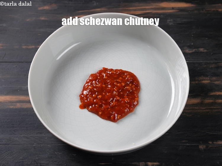 Step 3 – <strong>how to make batter </strong>1.&nbsp; In a deep bowl. Add 2 tbsp <a href="https://www.tarladalal.com/glossary-schezwan-sauce-schezuan-sauce-1872i">schezwan chutney</a>.