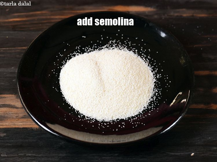Step 3 – In a plate, add &frac14; cup <a href="https://www.tarladalal.com/glossary-semolina-sooji-rava-rawa-603i">semolina (rava / sooji)</a>.