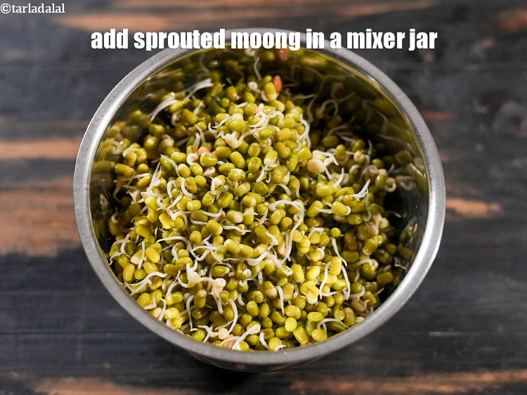 Step 3 – Add 1&frac14; cups <a href="https://www.tarladalal.com/glossary-sprouted-moong-moong-sprouts-988i">sprouted moong (whole green gram)</a> in a mixer jar.