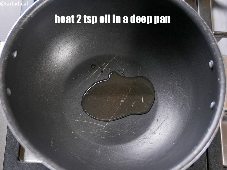 Step 3 – To make <strong>rosha recipe</strong>, heat 2 tsp oil in a deep pan.