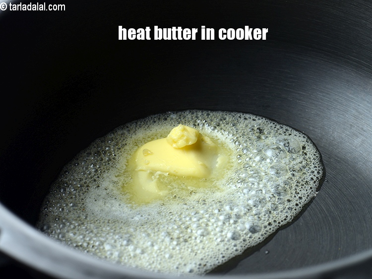 Step 3 – To make <strong>corn methi pulao</strong>, heat 1 tbsp&nbsp;butter in a pressure cooker.&nbsp;