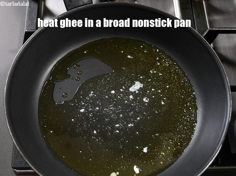 Step 3 – To make <strong>doodhi kheer recipe</strong>, heat 1&frac12; tbsp ghee in a broad nonstick pan.