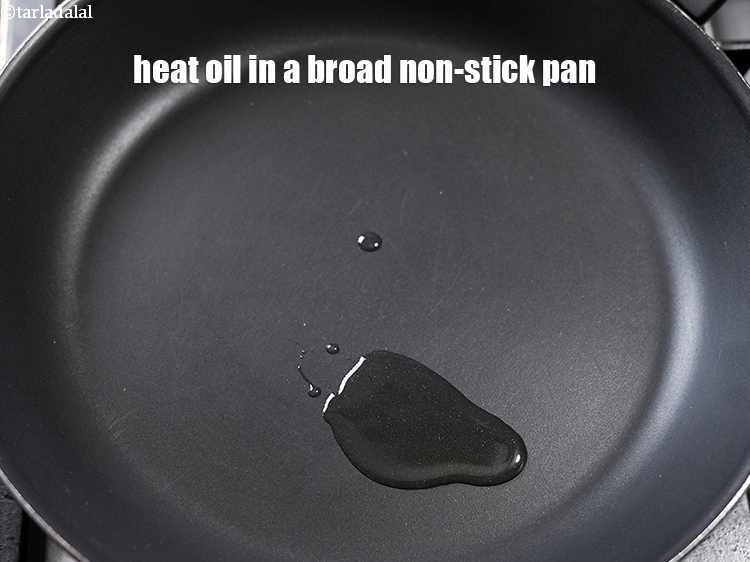 Step 3 – Heat 2 tsp oil in a broad non-stick pan.