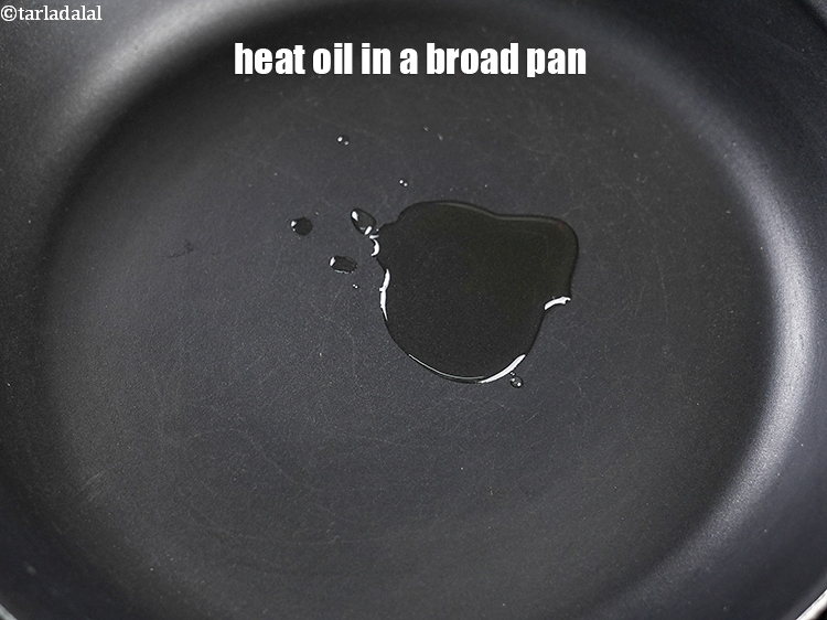 Step 5 – Heat 1 tsp oil in a broad pan.