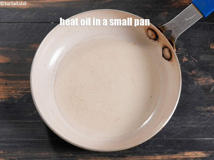 Step 3 – To make <strong>palak rava idli</strong>, heat 2 tsp oil in a small pan.