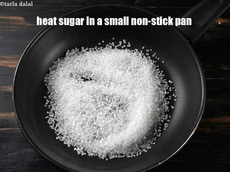 Step 3 – To make <strong>caramel custard</strong>, heat &frac12; cup sugar in a small non-stick pan.