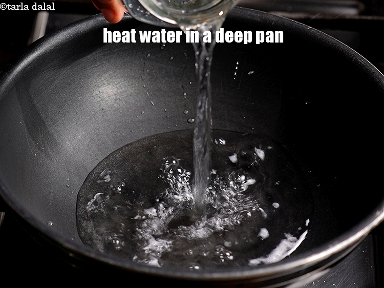 Step 3 – To make rice roti, heat 2 cups of water in a deep pan.