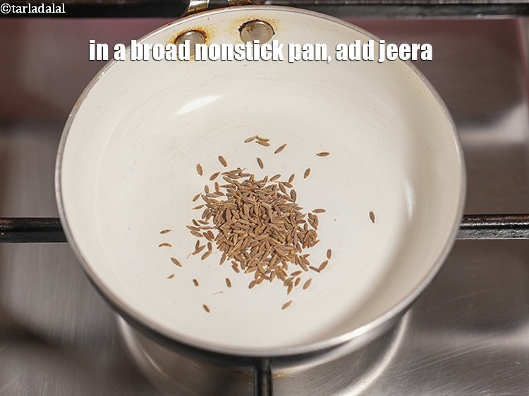 Step 3 – In a broad nonstick pan, add &frac12; tsp jeera.