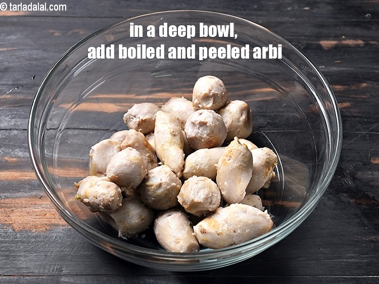 Step 3 – In a deep bowl, add 2 cups <a href="https://www.tarladalal.com/glossary-boiled-and-peeled-colocasia-roundels-2342i">boiled and peeled colocasia (arbi)</a>.