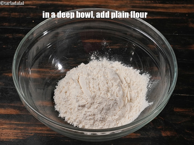 Step 3 – In a deep bowl, add &frac12; cup <a href="https://www.tarladalal.com/glossary-plain-flour-maida-188i">plain flour (maida)</a>.