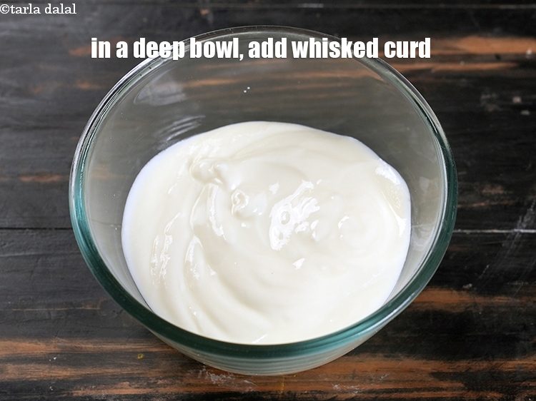 Step 3 – To make&nbsp;<strong>jamun raita</strong>, in a deep bowl, add 1 cup whisked curd.