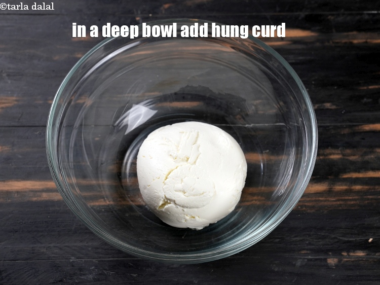 Step 3 – To make <strong>mango bhapa doi</strong>, in a deep bowl add 1 cup <a href="https://www.tarladalal.com/glossary-hung-curds-chakka-dahi-384i">hung curds …