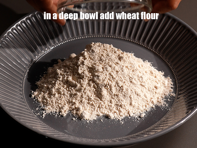 Step 3 – To make <strong>spinach puri</strong>, in a deep bowl, add 1 cup wheat flour.