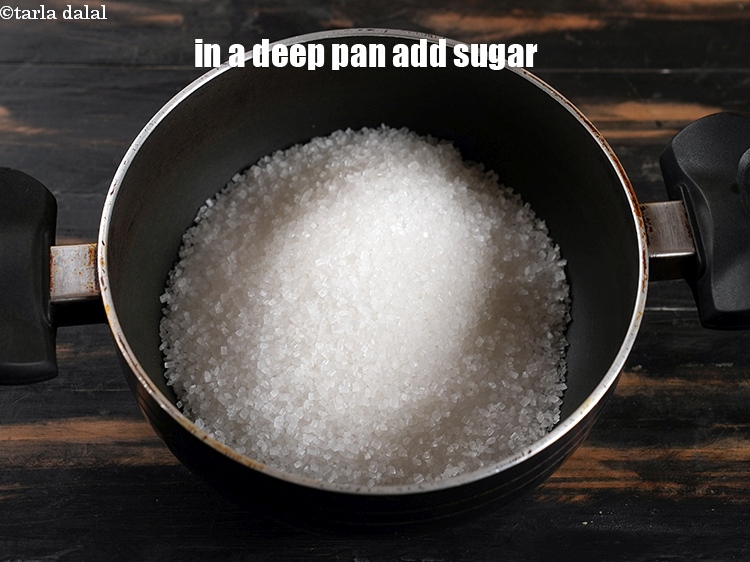 Step 3 – To make <strong>instant jaleb</strong>i, in a deep pan, add 2 cups sugar.