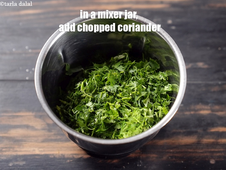 Step 3 – In a mixer jar, add &frac12; cup roughly <a href="https://www.tarladalal.com/glossary-chopped-coriander-783i">chopped coriander (dhania)</a>.