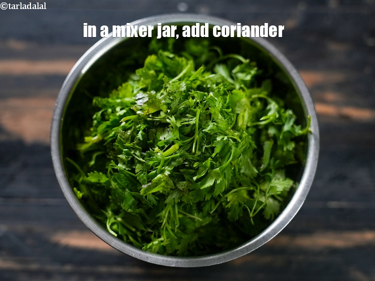 Step 3 – In a mixer jar, add 1 cup <a href="https://www.tarladalal.com/glossary-chopped-coriander-783i">chopped coriander (dhania)</a>.