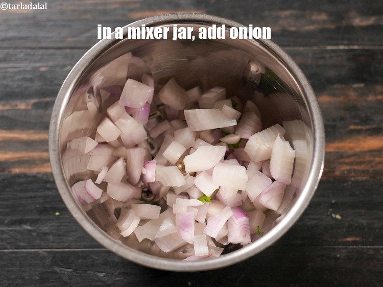 Step 4 – In a mixer jar, add &frac14; cup roughly chopped onion.