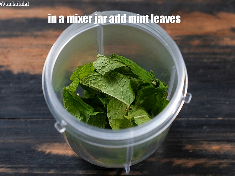 Step 6 – In a mixer jar, add &frac34; cup <a href="https://www.tarladalal.com/glossary-mint-leaves-pudina-phudina-521i">mint leaves (pudina)</a>.