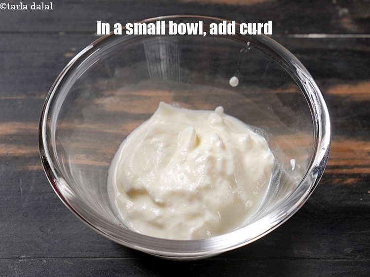 Step 3 – In a small bowl, add &frac14; cup fresh curd.