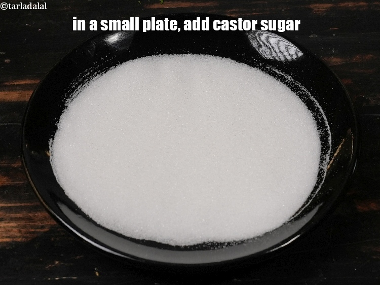 Step 3 – In a small plate, add 3 tbsp <a href="https://www.tarladalal.com/glossary-castor-sugar-279i">castor sugar</a>.