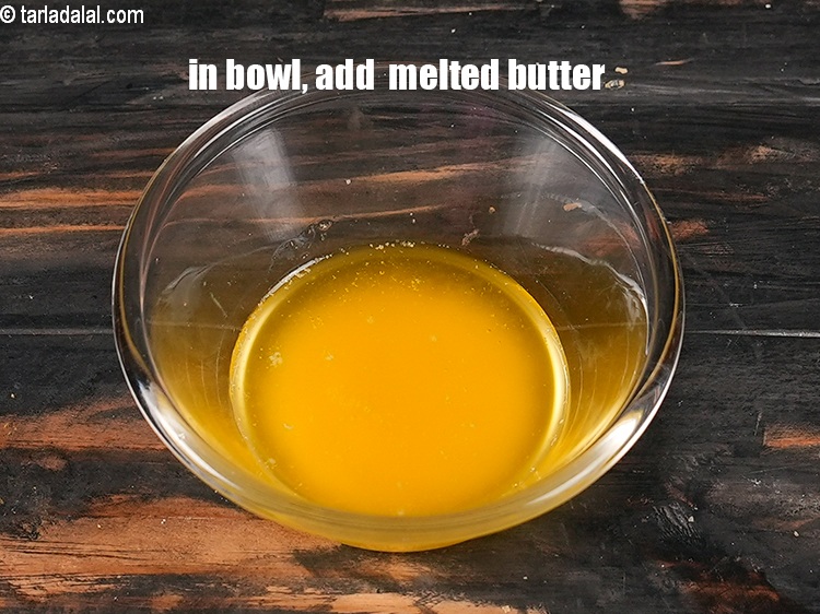Step 6 – In a small bowl, &frac14; cup <a href="https://www.tarladalal.com/glossary-melted-butter-1941i">melted butter</a>.
