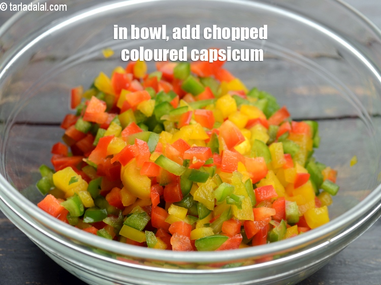 Step 3 – In a deep bowl, add 1 cup <a href="https://www.tarladalal.com/glossary-chopped-coloured-capsicum-2800i">chopped coloured capsicum</a>.