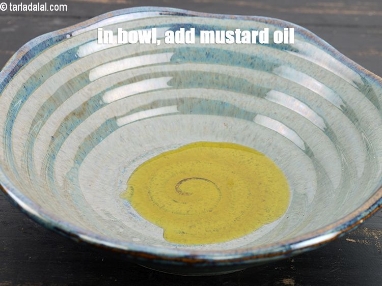 Step 3 – In a deep bowl, add 1 tbsp <a href="https://www.tarladalal.com/glossary-mustard-oil-rai-ka-tel-sarson-ka-tel-942i">mustard (rai / sarson) oil</a>.&nbsp;