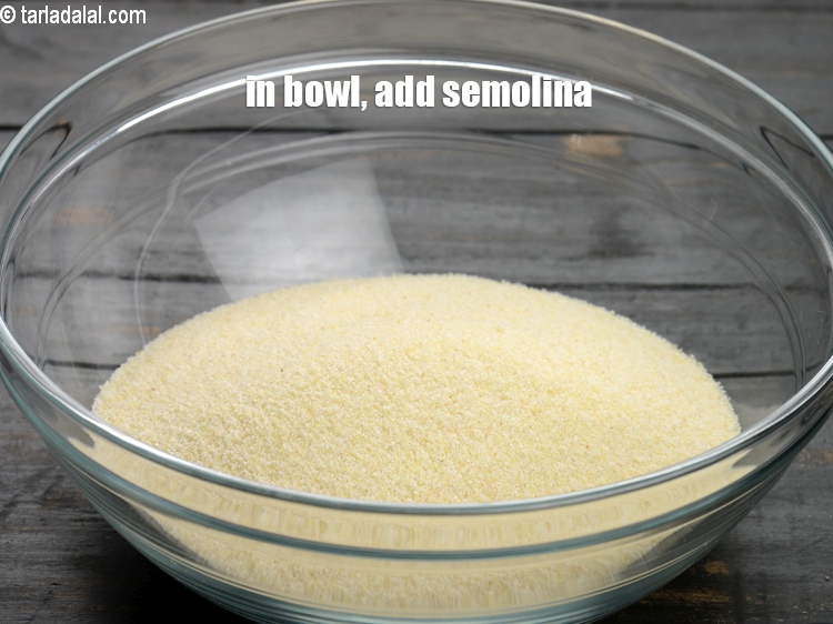 Step 4 – To make stuffed rava dhokla, in a deep bowl, add 1 &frac12; cup <a href="https://www.tarladalal.com/glossary-semolina-sooji-rava-rawa-603i">semolina …