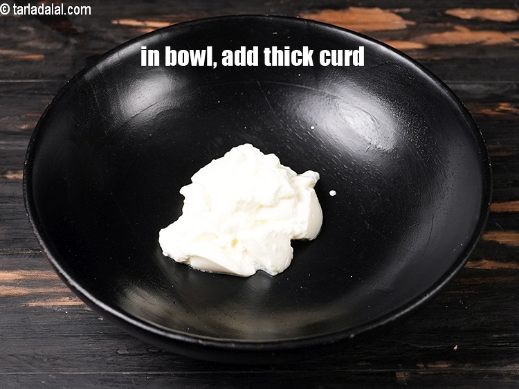 Step 4 – To make <strong>tandoori aloo</strong>, in a deep bowl, add 1/2 cup thick&nbsp;<a href="https://www.tarladalal.com/glossary-curd-dahi-yogurt-yoghurt-383i">curd (dahi)</a>.