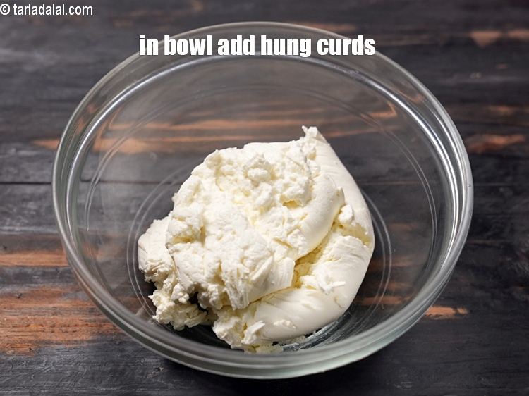 Step 3 – To make <strong>chilli oil curd dip</strong>, in a deep bowl add 1 cup&nbsp;<a href="https://www.tarladalal.com/glossary-hung-curds-chakka-dahi-384i">hung curds …