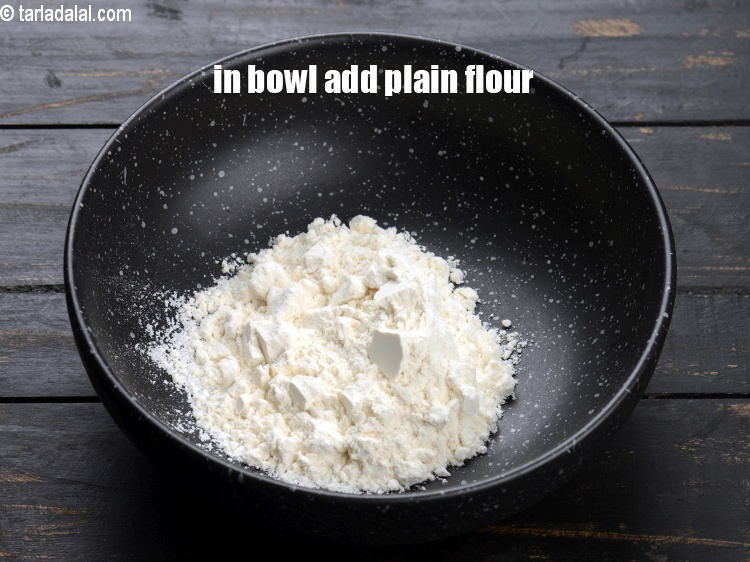 Step 4 – To make <strong>veg lollipop recipe</strong>, in a small bowl add &frac14; cup&nbsp;<a href="https://www.tarladalal.com/glossary-plain-flour-maida-188i">plain flour (maida)</a>.