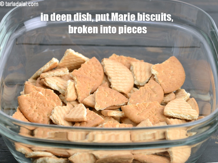 Step 3 – In a deep dish, put 2 cups of <a href="https://www.tarladalal.com/glossary-marie-biscuit-204i">marie biscuits</a>&nbsp;, broken into pieces.