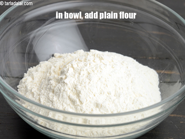 Step 4 – In a deep bowl, add 1&frac12; cups <a href="https://www.tarladalal.com/glossary-plain-flour-maida-188i">plain flour (maida)</a>.