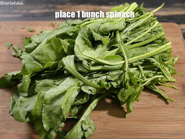 Step 3 – Place 1 bunch&nbsp;<a href="https://www.tarladalal.com/glossary-spinach-palak-255i">spinach (palak)</a>&nbsp;on a clean, dry surface.&nbsp;