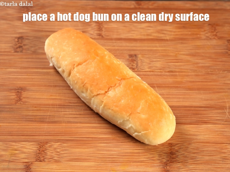 Step 7 – To make <strong>Manchurian hot dog roll</strong>, place a hot dog bun on a clean dry …