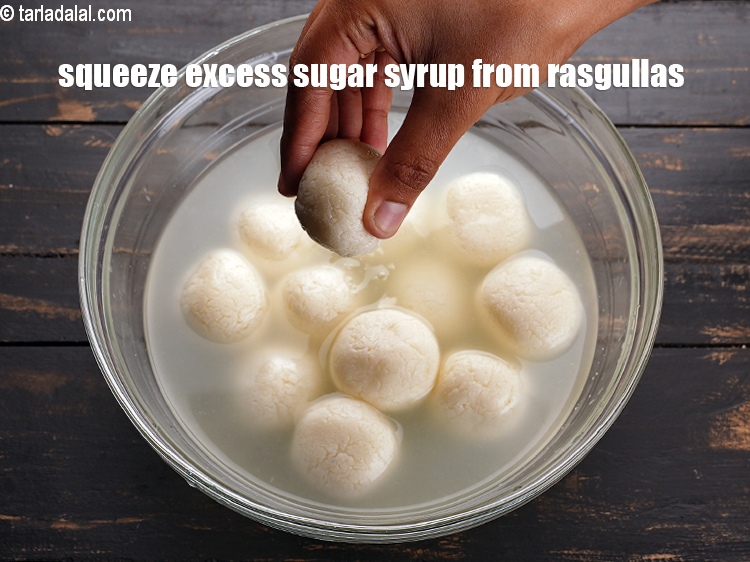 Step 3 – To make <strong>baked rasgulla recipe</strong>, squeeze the excess sugar syrup from the rasgullas.&nbsp;