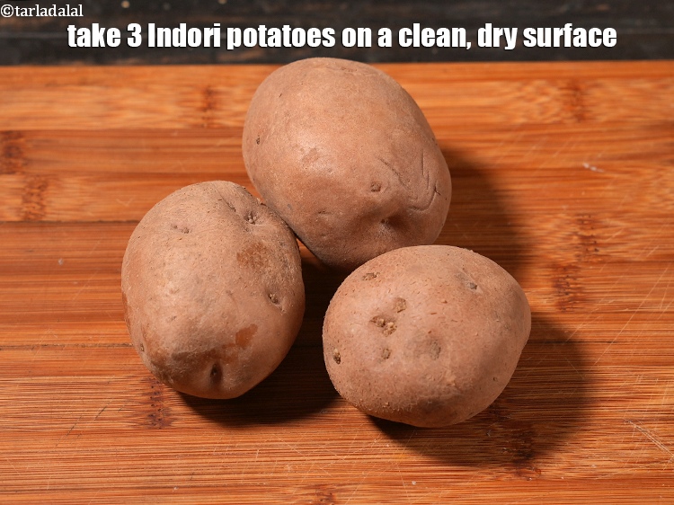 Step 4 – Take 3 Indori potatoes on a clean, dry surface.