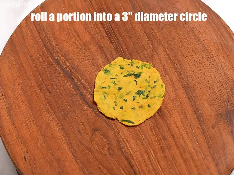 Step 12 – Roll each portion into a circle of about 75 mm. (3") diameter.