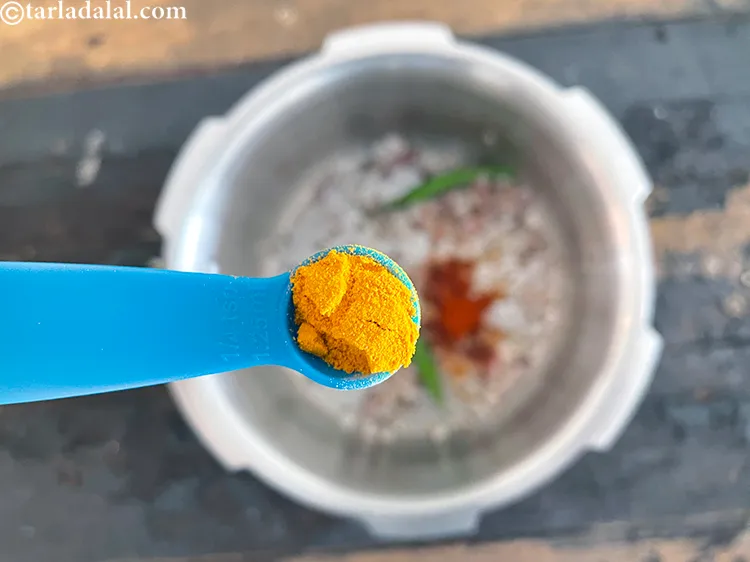 Step 27 – Add&nbsp;<meta charset="UTF-8" />1/4 tsp&nbsp;<a href="glossary-turmeric-powder-haldi-645i">turmeric powder (haldi)</a>.