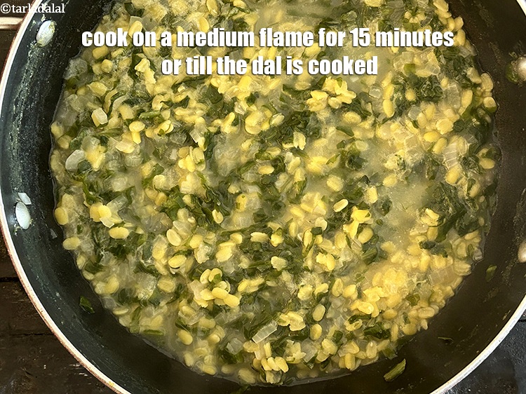 Step 12 – Cook on a medium flame for 15&nbsp;minutes or till the dal is cooked.&nbsp;