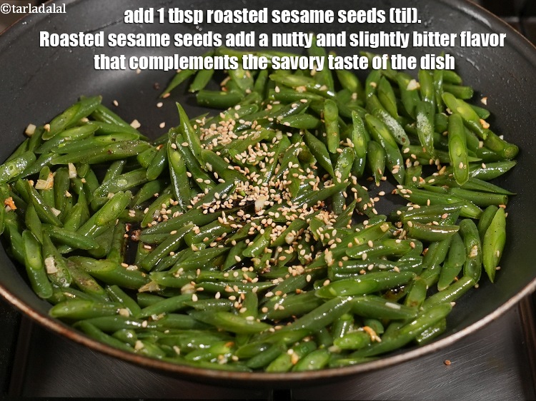 Step 21 – <html><head></head><body><p>Add 1 tbsp <a href="https://www.tarladalal.com/glossary-roasted-sesame-seeds-2271i">roasted sesame seeds (til)</a>.&nbsp;Roasted sesame seeds add a nutty and slightly …