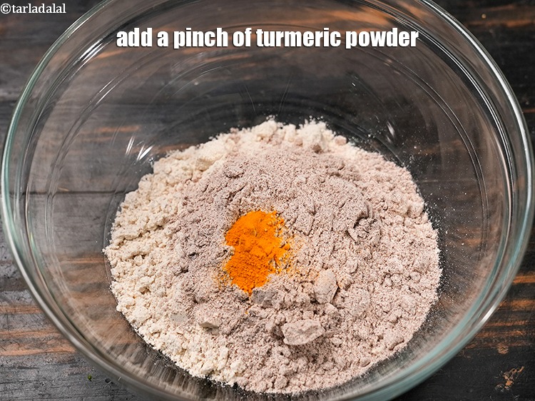 Step 13 – Add a pinch of <a href="https://www.tarladalal.com/glossary-turmeric-powder-haldi-645i">turmeric powder (haldi)</a>.&nbsp;