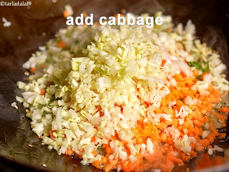 Step 15 – Add &frac14; cup finely <a href="https://www.tarladalal.com/glossary-chopped-cabbage-781i">chopped cabbage</a>.
