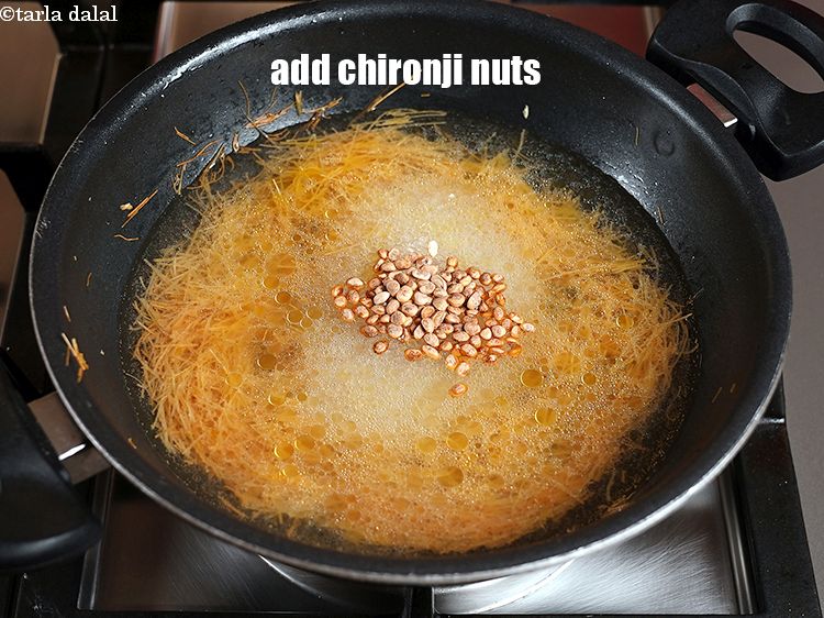 Step 12 – Add 1 tbsp&nbsp;<a href="https://www.tarladalal.com/glossary-chironji-nuts-charoli-piyal-seeds-305i">chironji nuts</a>.